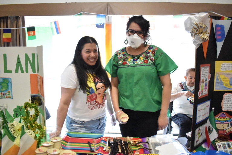 Mothers in the community represent their cultures at booths for International Day