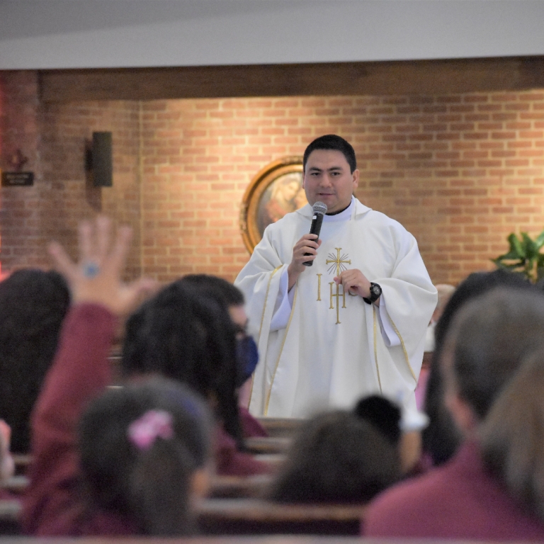Father Jorge delivering a homily in the Church
